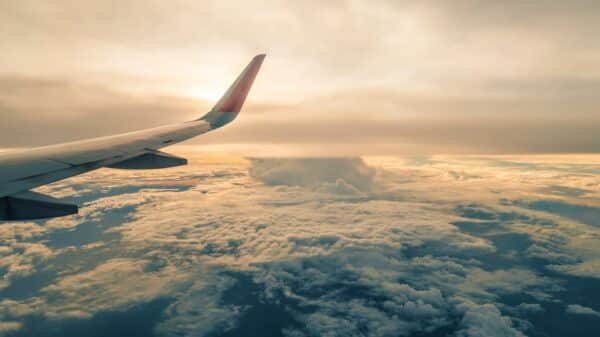 a view of the wing of an airplane in the sky